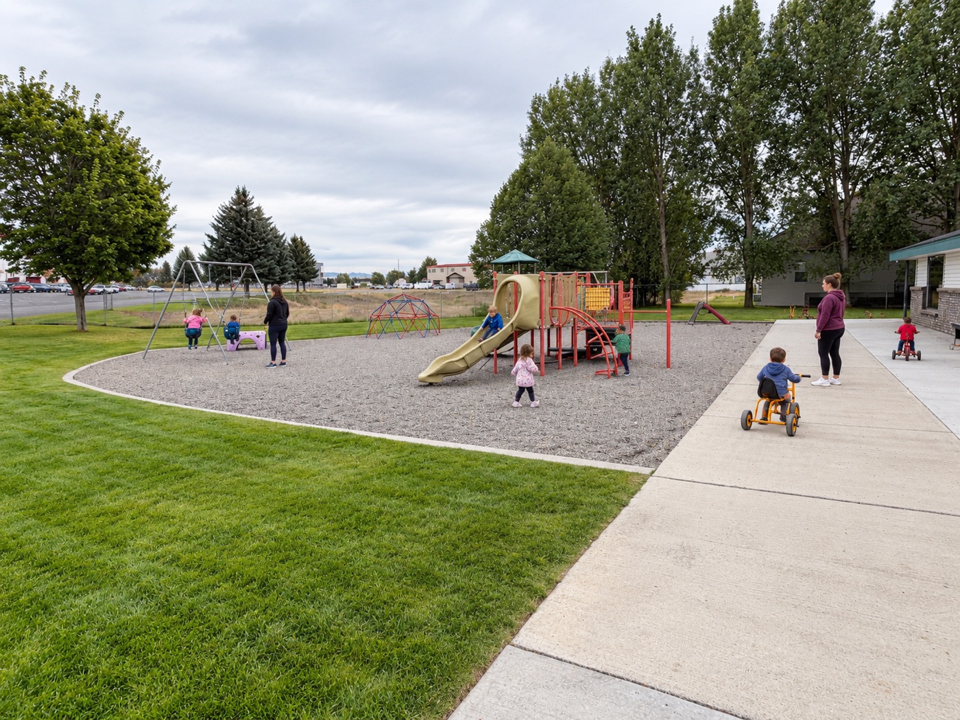 Our backyard playground and trike path
